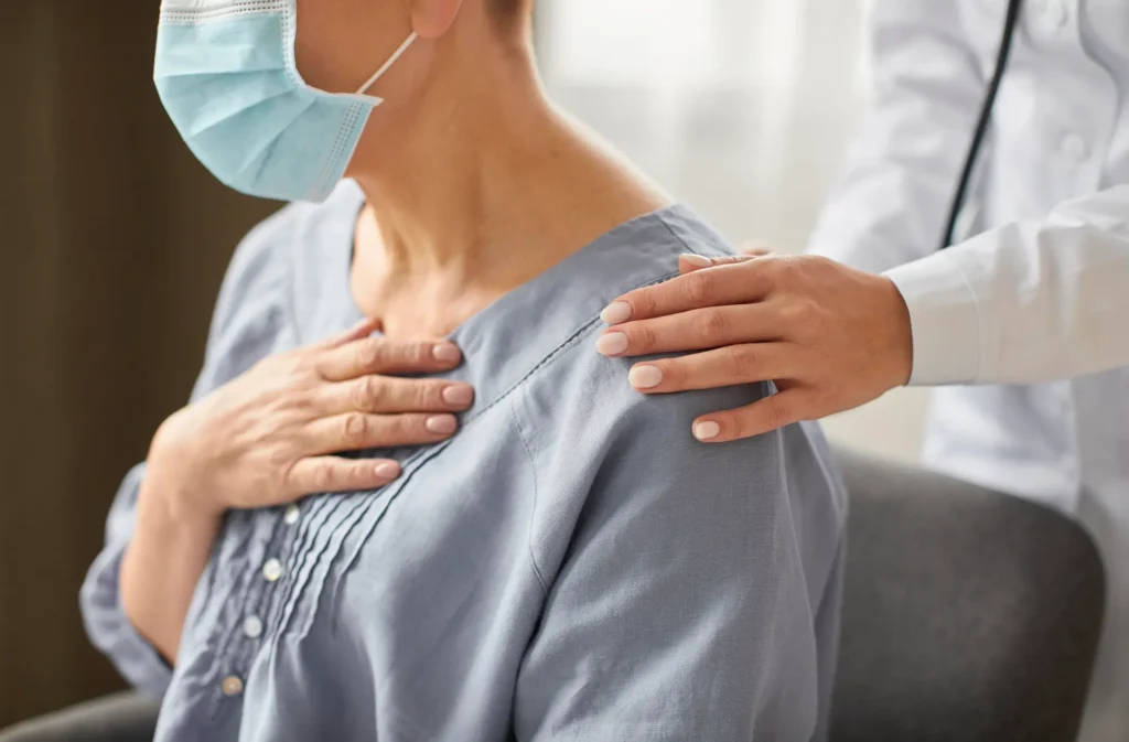 Early Signs of Breast Cancer image showing a patient consulting with a healthcare professional about breast health concerns, early detection, and breast cancer evaluation.